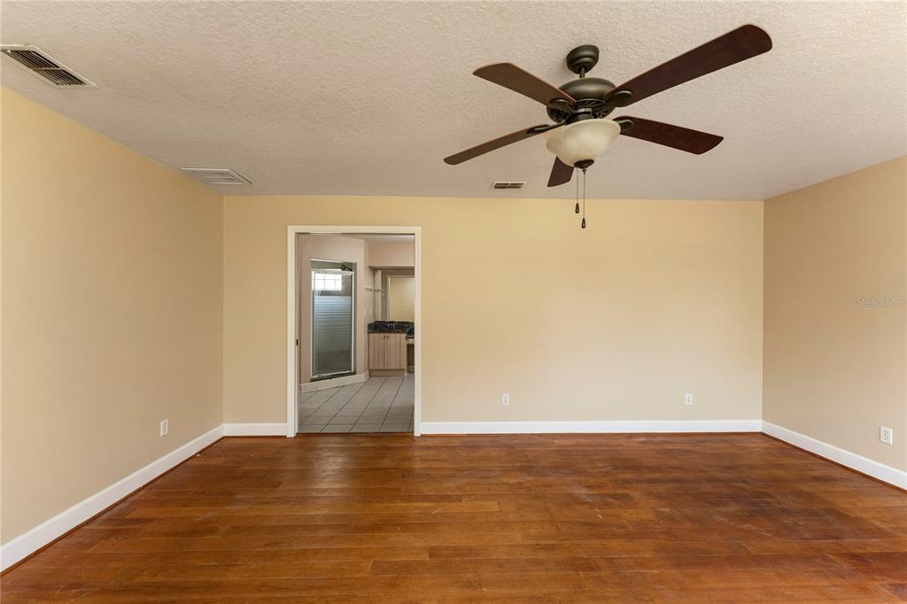 16017 Johns Lake Road Clermont, FL 34711 - Photo 23 of 62 wooden floor in an empty room