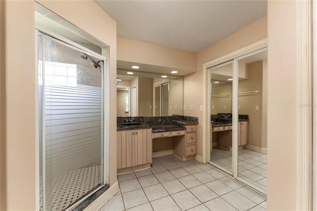 16017 Johns Lake Road Clermont, FL 34711 - Photo 24 of 62 a large bathroom with a glass door shower