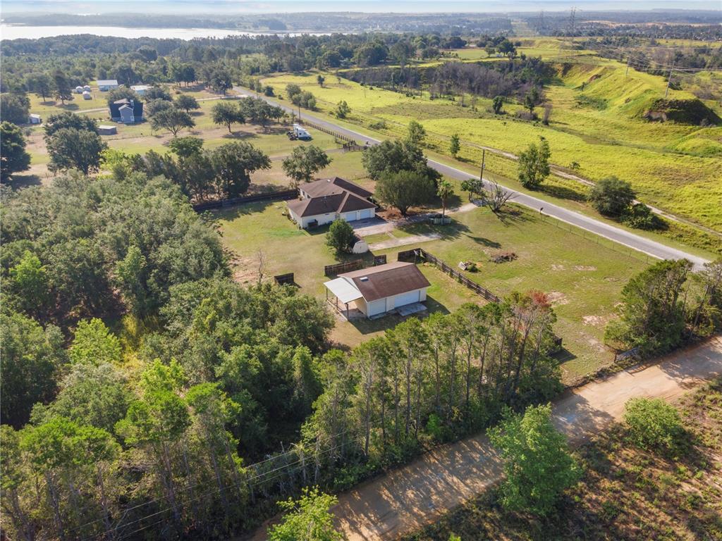 16017 Johns Lake Road Clermont, FL 34711 - Photo 3 of 62 an aerial view of residential houses with outdoor space
