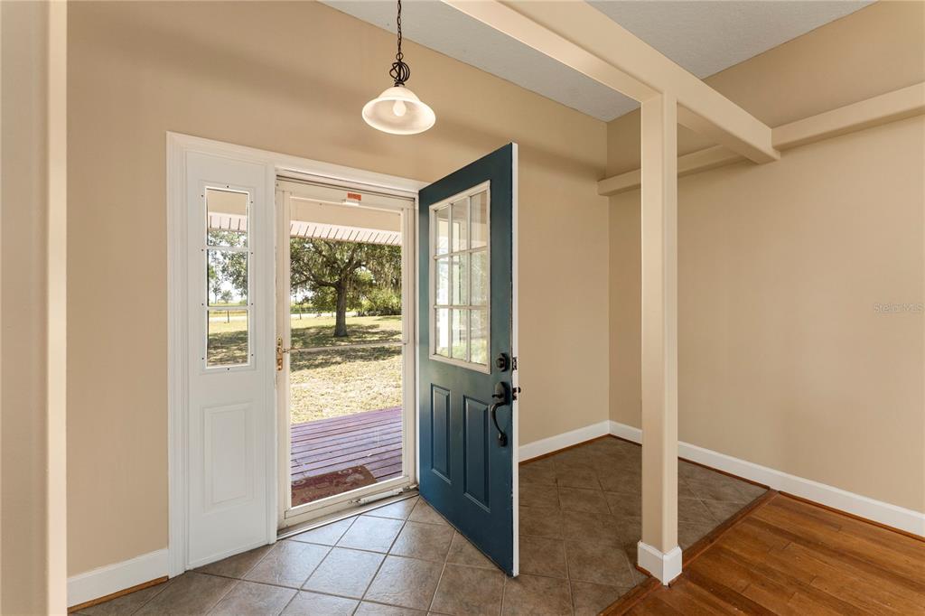 16017 Johns Lake Road Clermont, FL 34711 - Photo 31 of 62 a view of entryway with wooden floor and door