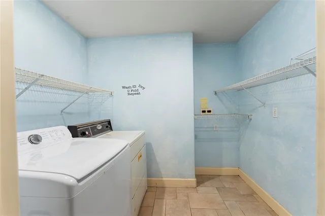 a view of a livingroom with a fireplace and window