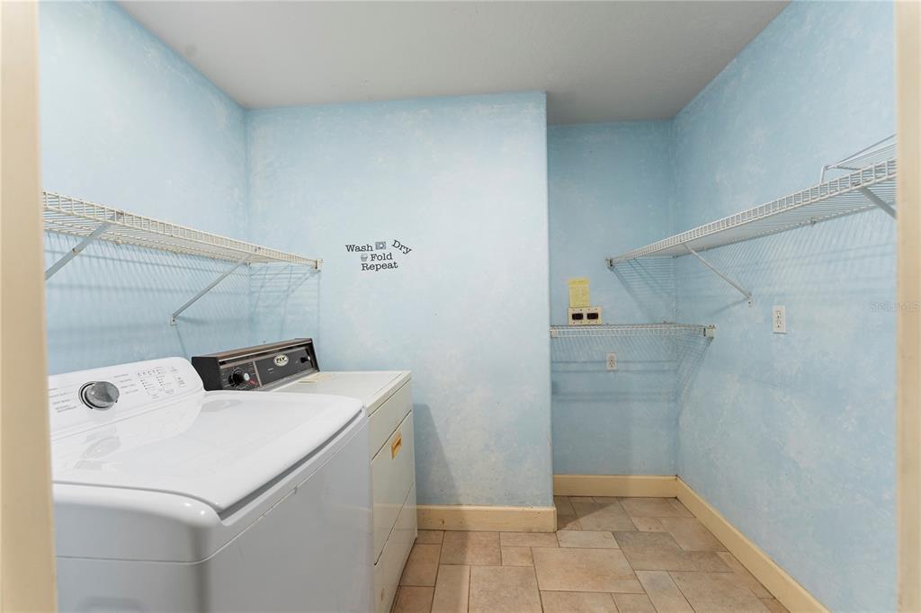 16017 Johns Lake Road Clermont, FL 34711 - Photo 32 of 62 a utility room with dryer and washer