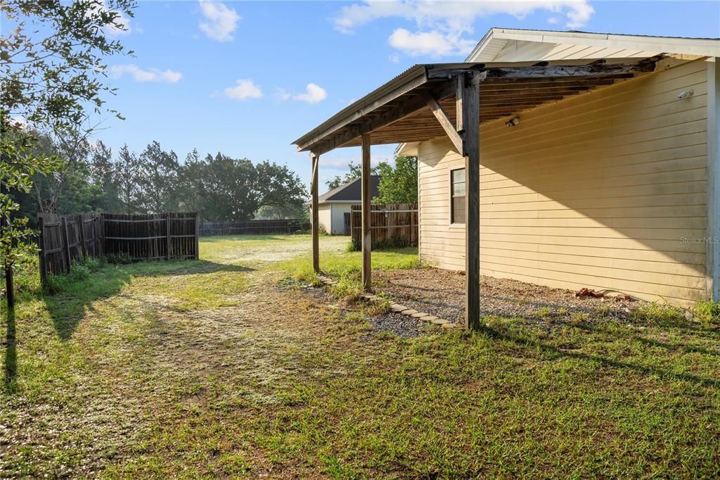 16017 Johns Lake Road Clermont, FL 34711 - Photo 40 of 62 a view of a backyard of a house