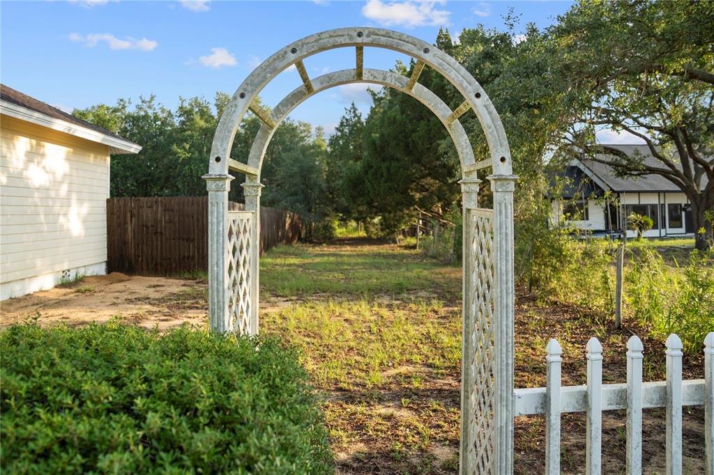 16017 Johns Lake Road Clermont, FL 34711 - Photo 45 of 62 a backyard of a house with lots of green space
