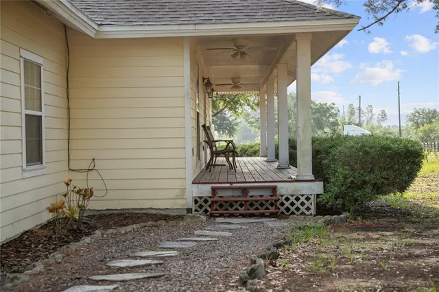 a bench is sitting in front of a house