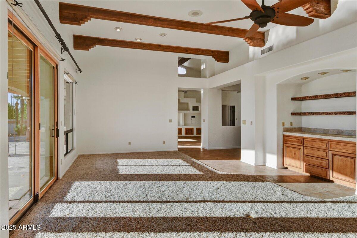 18445 East Flicker Drive Rio Verde, AZ 85263 - Photo 12 of 27 a view of a livingroom with wooden floor and a ceiling fan