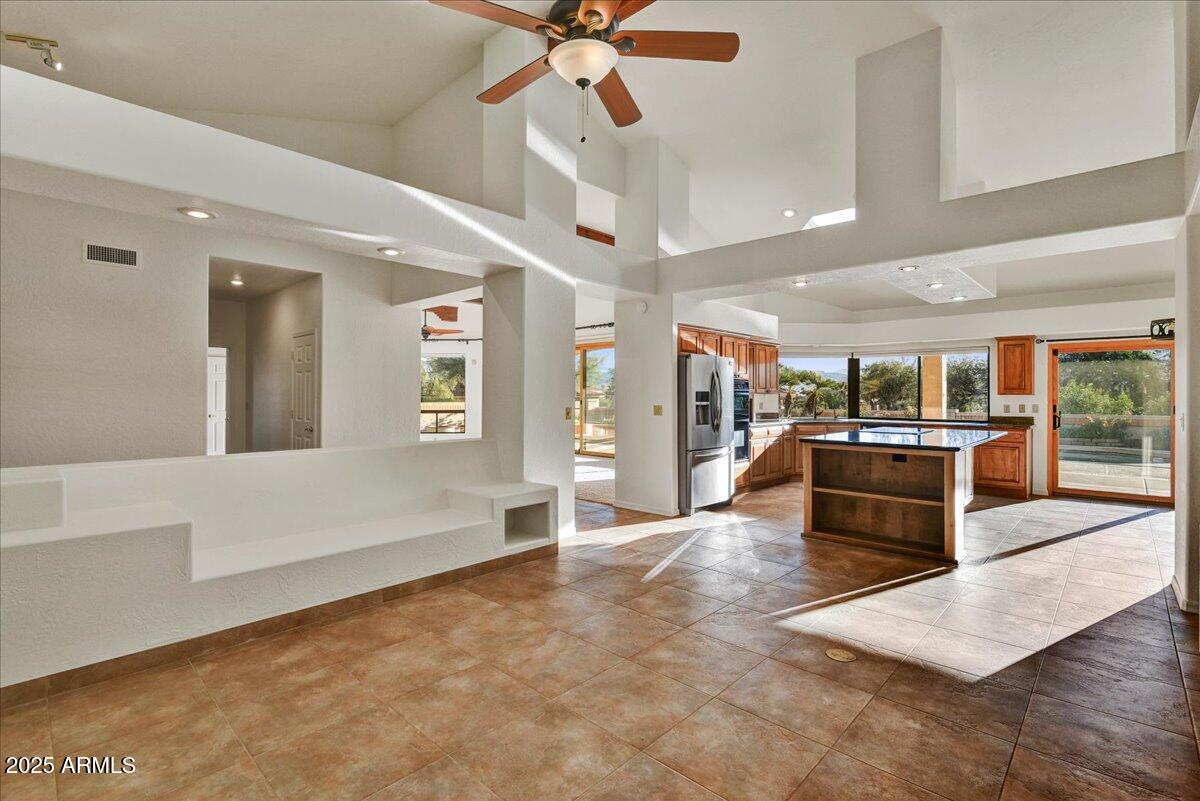 18445 East Flicker Drive Rio Verde, AZ 85263 - Photo 14 of 27 a living room with stainless steel appliances kitchen island granite countertop furniture and a view of kitchen