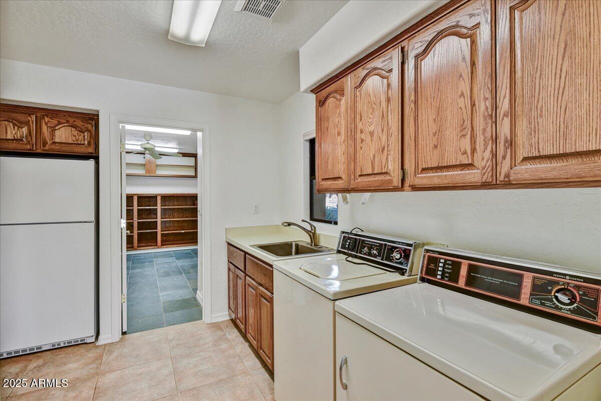 18445 East Flicker Drive Rio Verde, AZ 85263 - Photo 16 of 27 a utility room with dryer and washer
