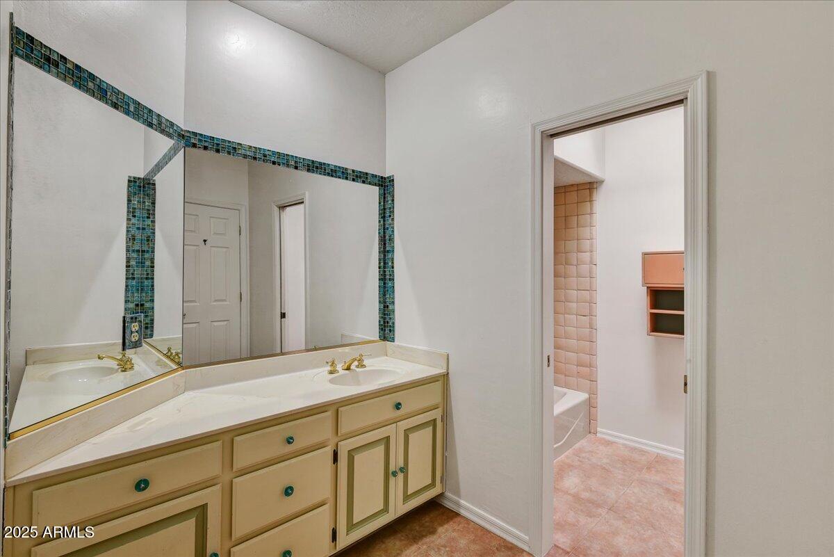 18445 East Flicker Drive Rio Verde, AZ 85263 - Photo 24 of 27 a bathroom with a double vanity sink and mirror