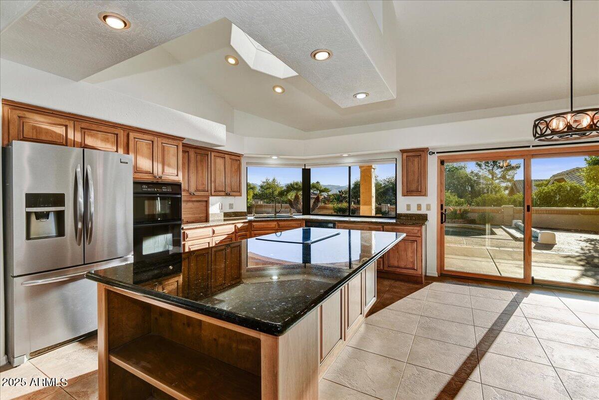 18445 East Flicker Drive Rio Verde, AZ 85263 - Photo 5 of 27 a kitchen with stainless steel appliances granite countertop a sink and counter space