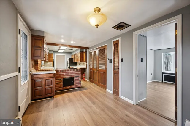 a open kitchen with a sink and a stove top oven