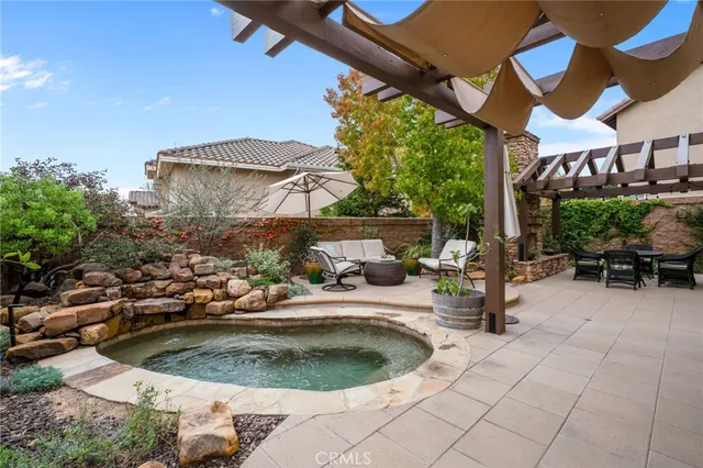 a view of a backyard with sitting area and furniture