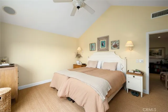 a bedroom with a bed and a tv