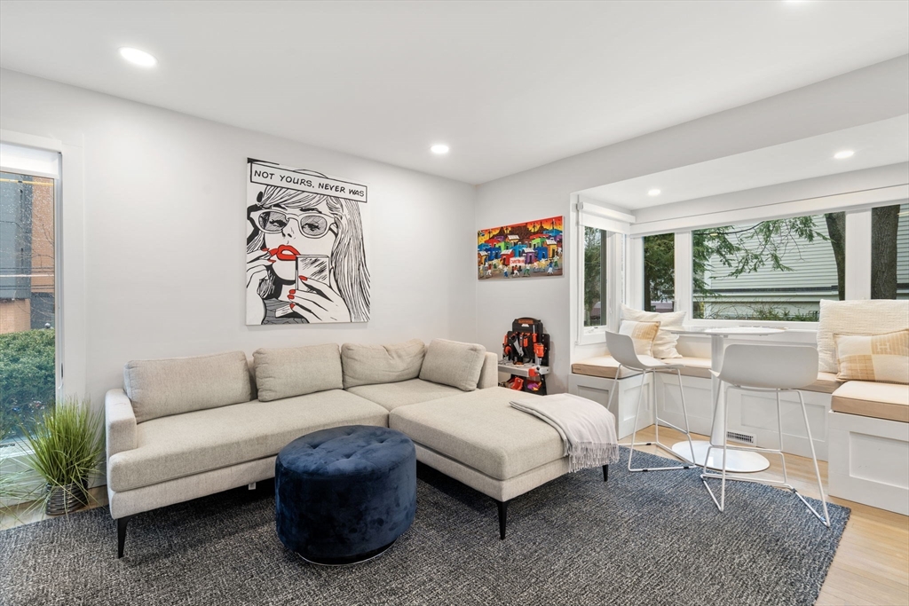 107 Centre Street, Unit A Brookline, MA 02446 - Photo 4 of 15 a living room with furniture and a large window