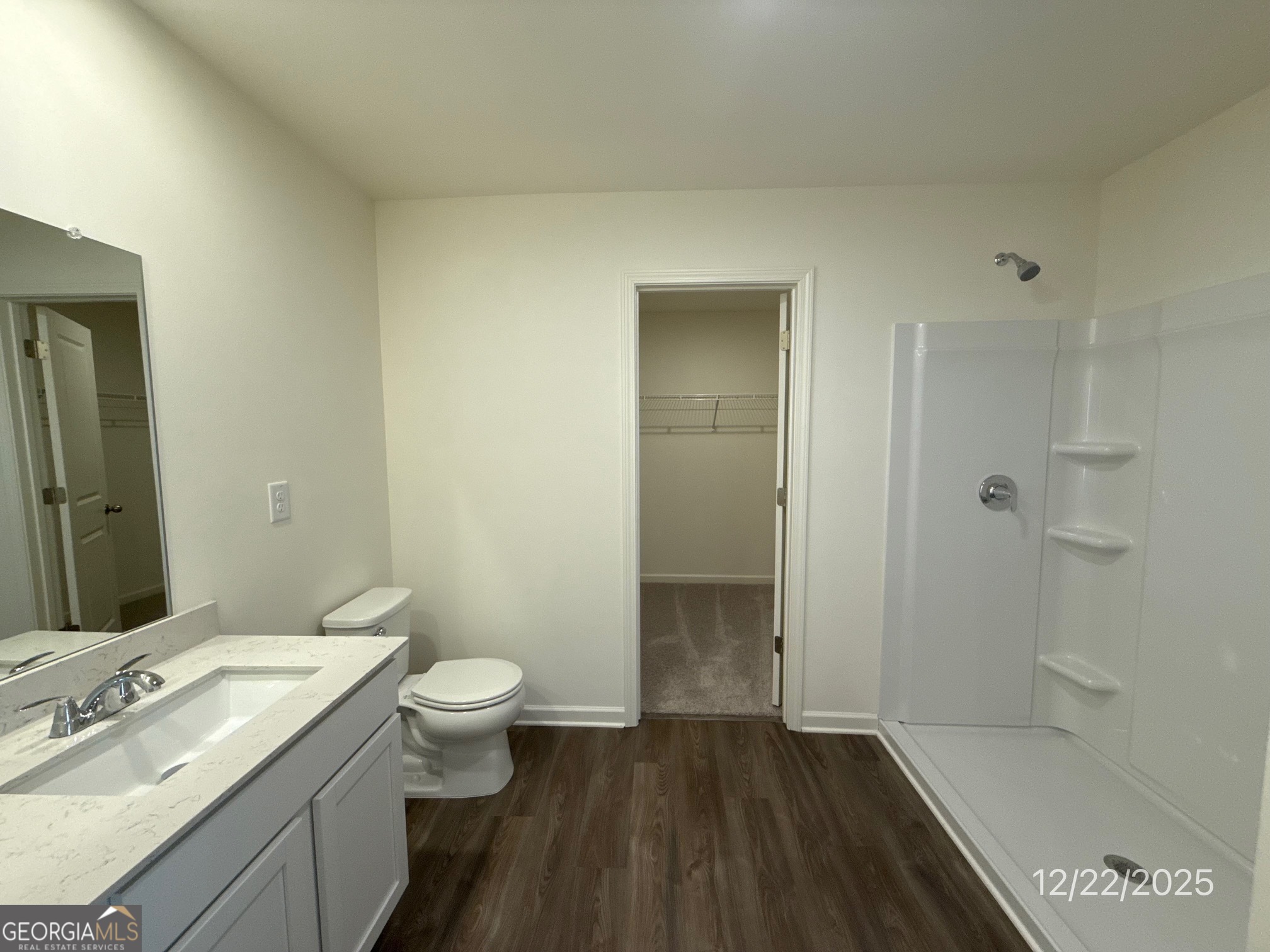 487 Grand Magnolia Street Jackson, GA 30233 - Photo 13 of 18 a bathroom with a granite countertop sink a toilet and shower