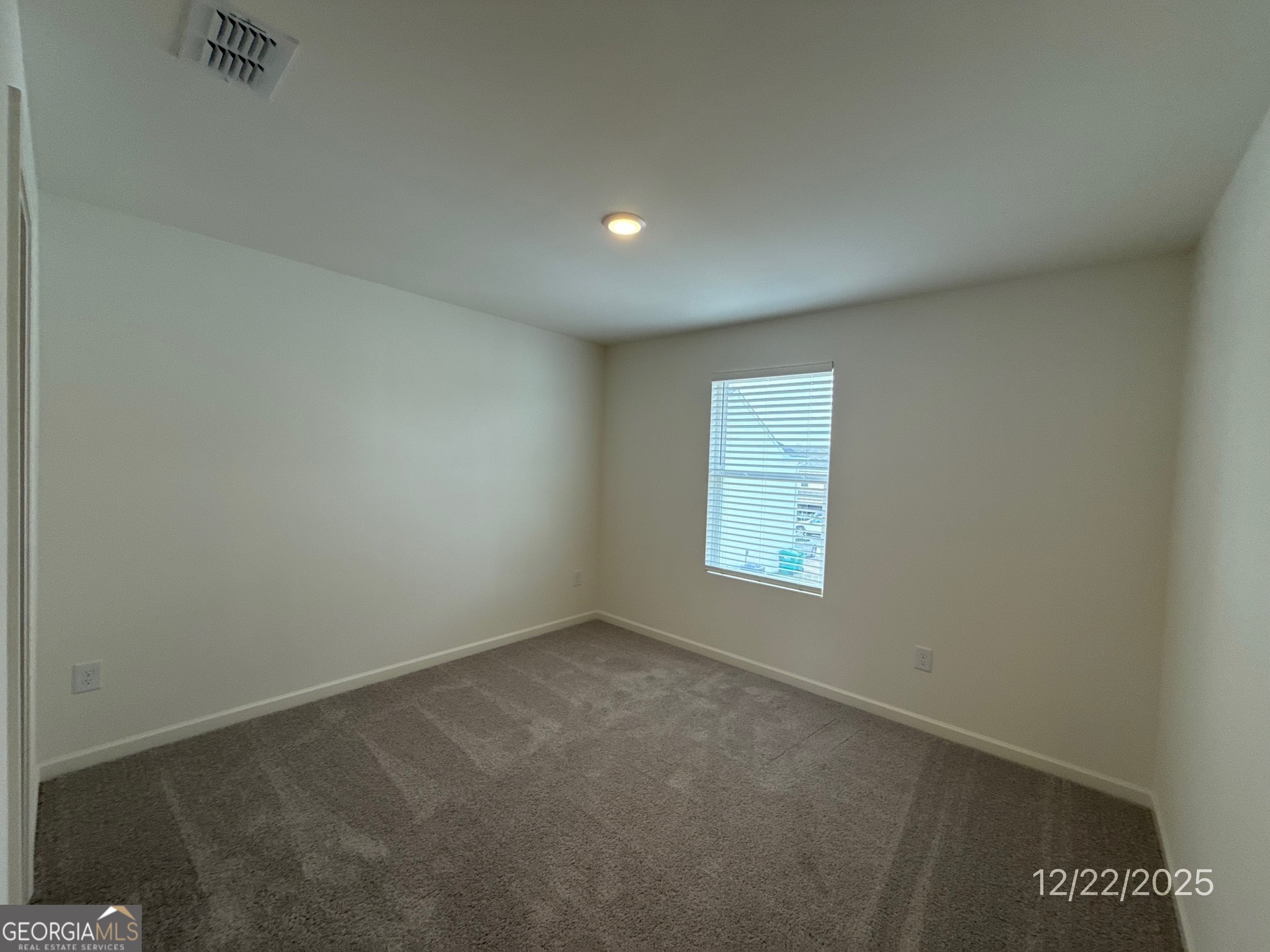 487 Grand Magnolia Street Jackson, GA 30233 - Photo 15 of 18 an empty room with a window