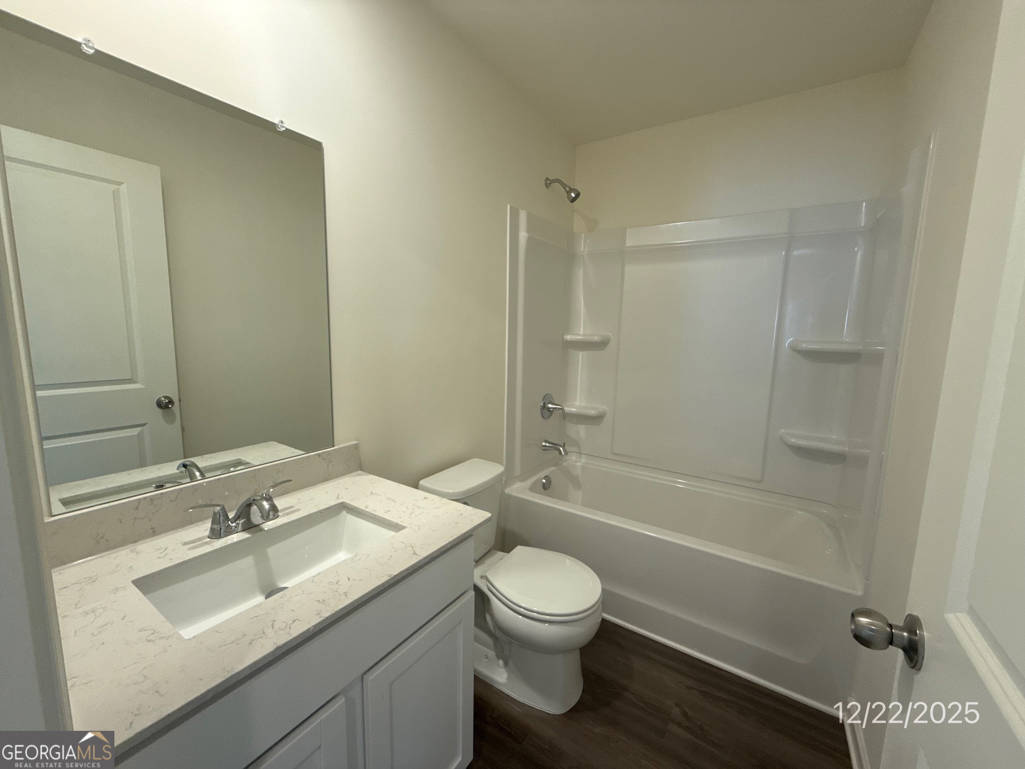 487 Grand Magnolia Street Jackson, GA 30233 - Photo 16 of 18 a bathroom with a sink toilet tub and shower