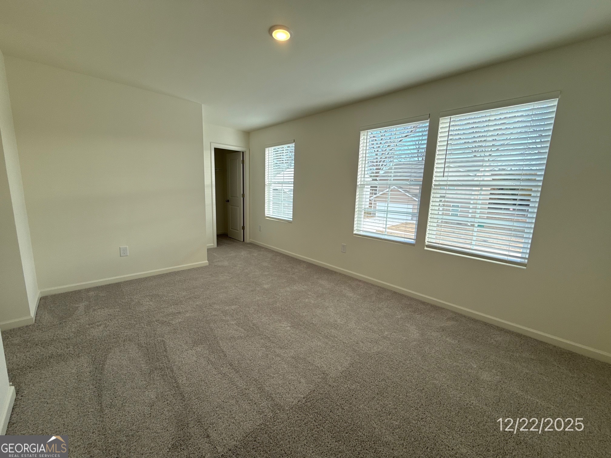 487 Grand Magnolia Street Jackson, GA 30233 - Photo 17 of 18 a view of an empty room with a window