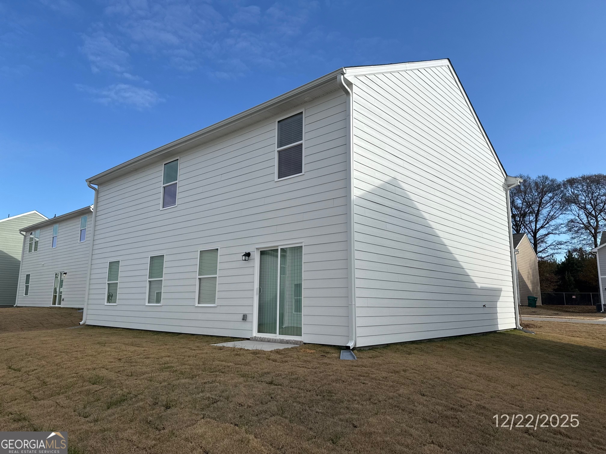487 Grand Magnolia Street Jackson, GA 30233 - Photo 18 of 18 a view of a house with a backyard