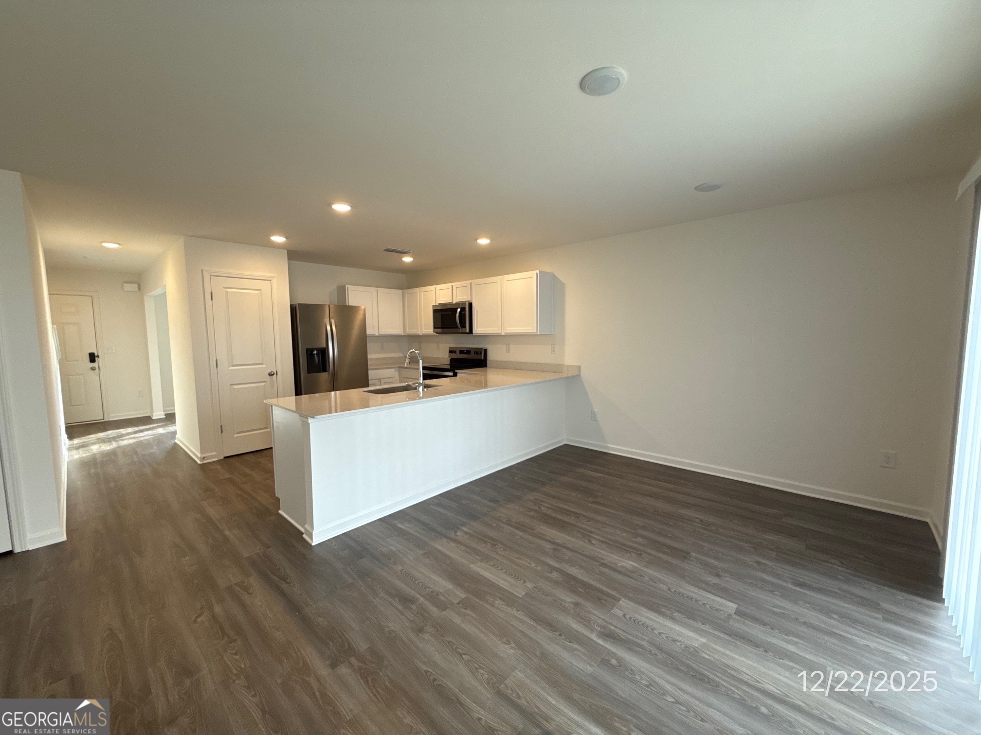 487 Grand Magnolia Street Jackson, GA 30233 - Photo 10 of 18 a view of kitchen with wooden floor