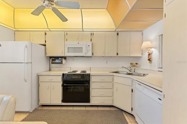 a spacious bedroom with a bed and a window