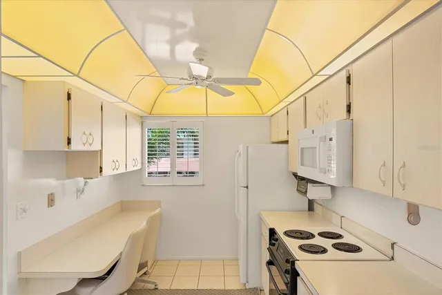 a bedroom with two beds and a window