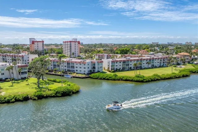 an aerial view of a houses with a lake view