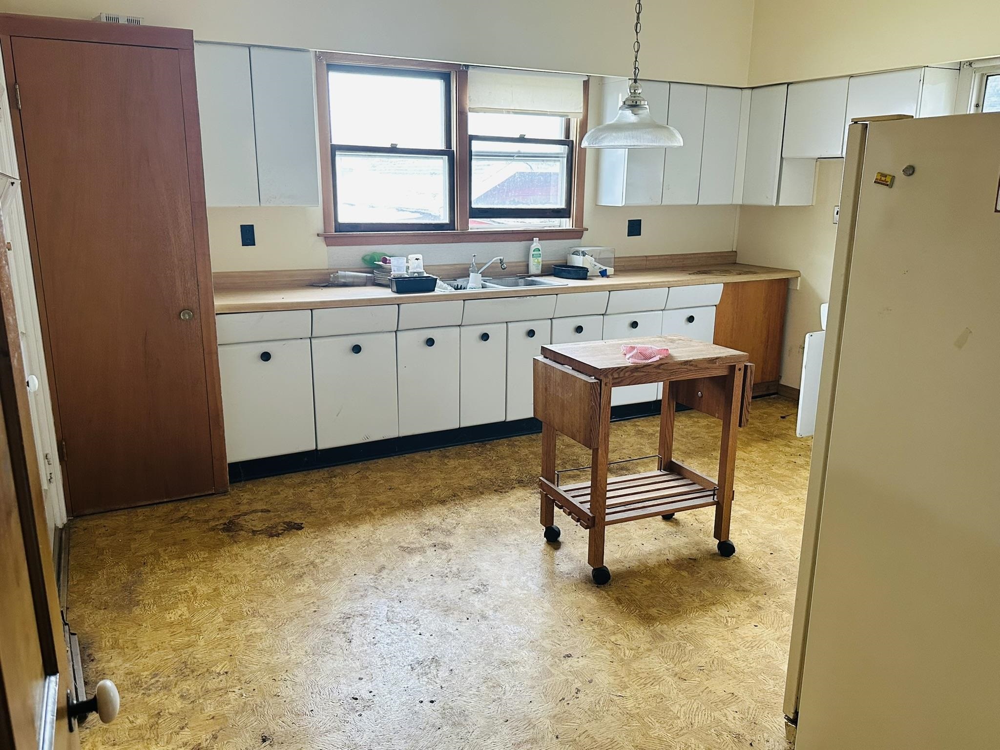 35 3rd Street Savanna, IL 61074 - Photo 12 of 20 a kitchen with a sink cabinets and window