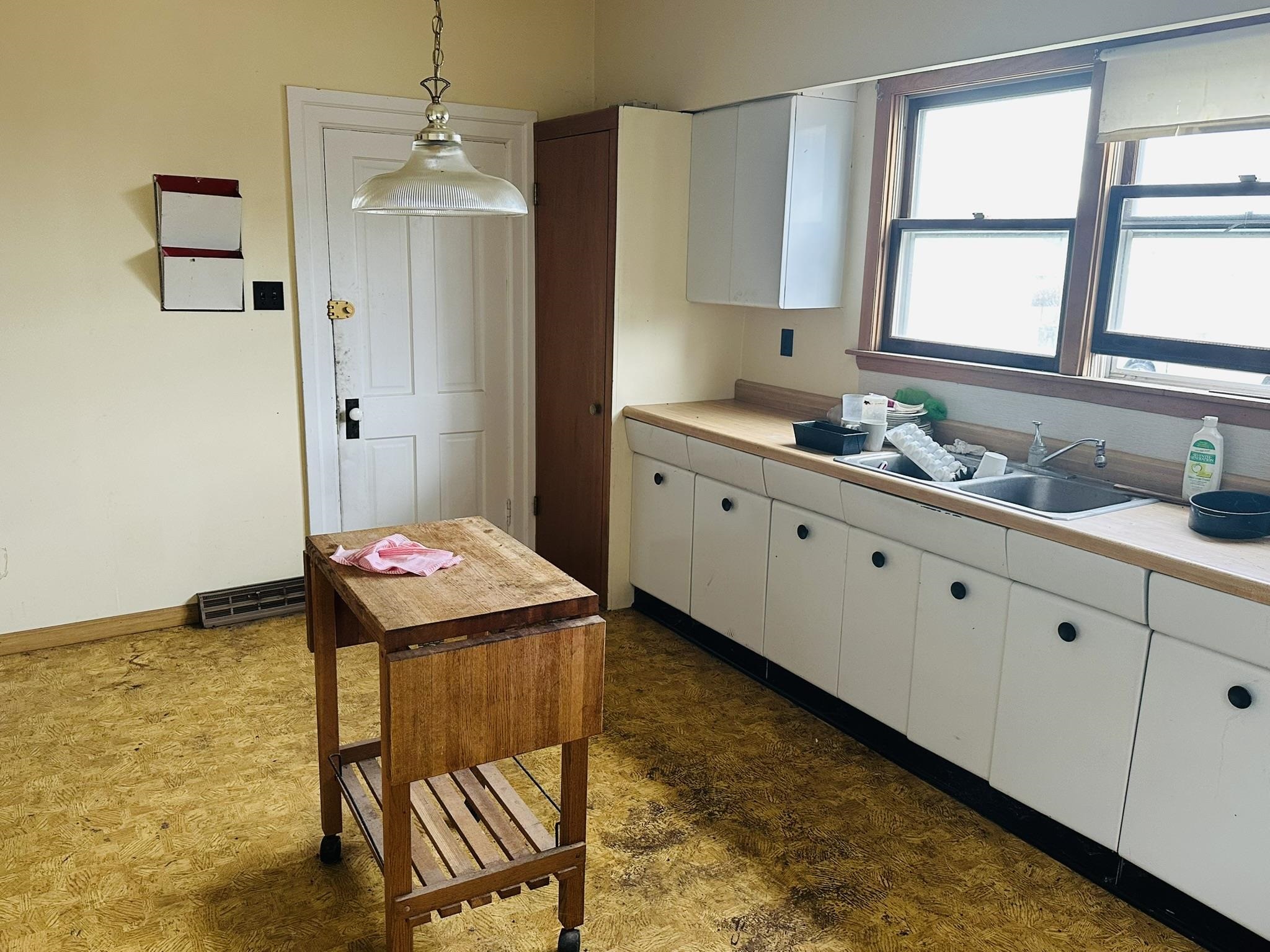 35 3rd Street Savanna, IL 61074 - Photo 14 of 20 a kitchen that has a sink and a window in it
