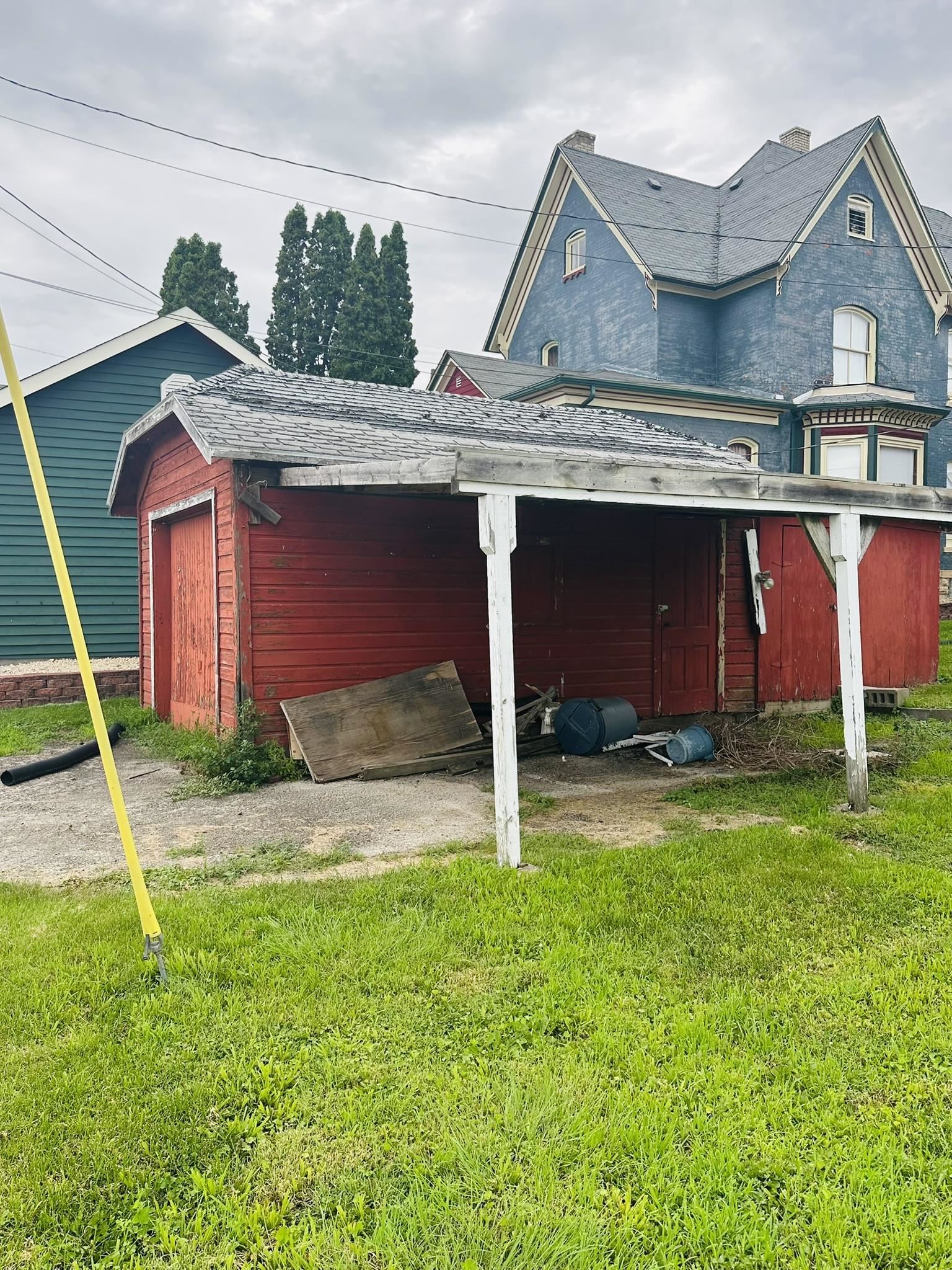 35 3rd Street Savanna, IL 61074 - Photo 2 of 20 a front view of house with yard and garage