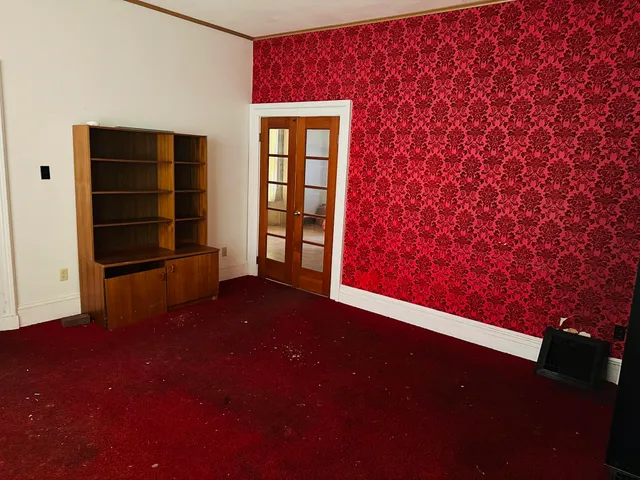 a view of an empty room with a window