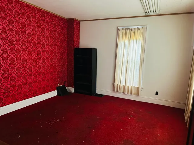 an empty room with windows