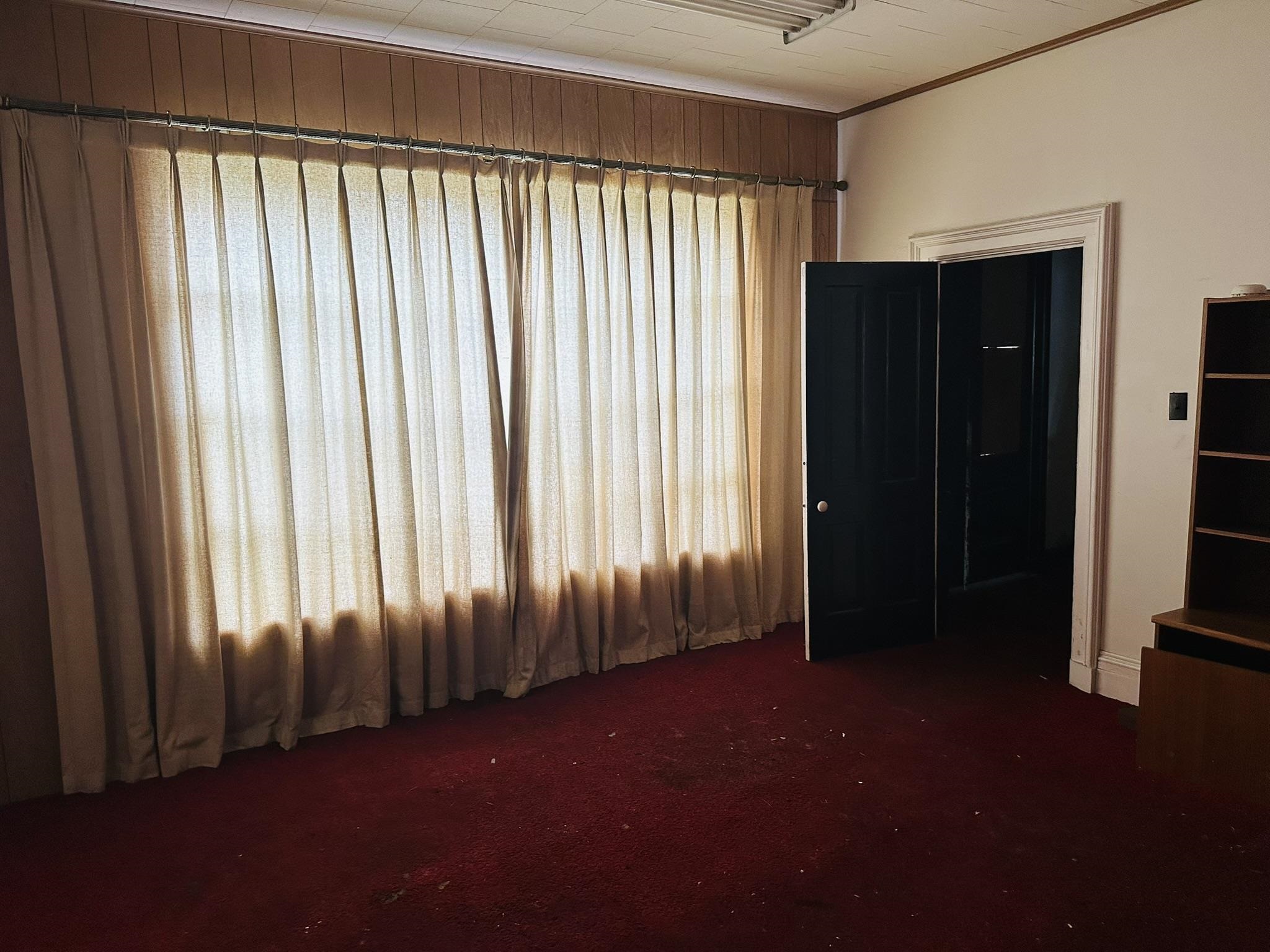 35 3rd Street Savanna, IL 61074 - Photo 7 of 20 an empty room with windows