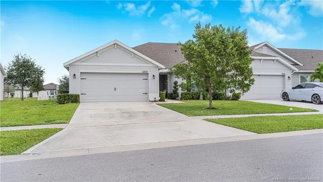 an aerial view of a house with a swimming pool