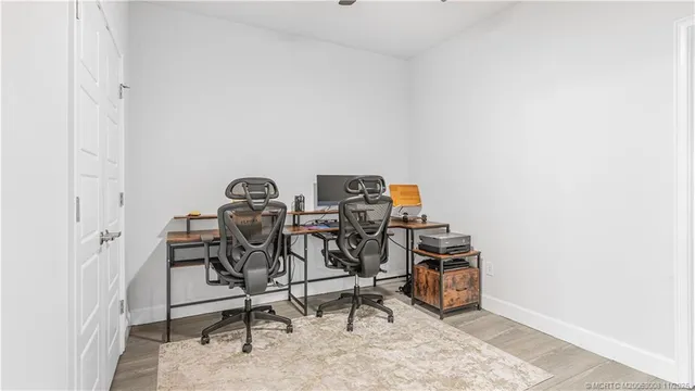 a bathroom with a granite countertop sink a large mirror and a shower