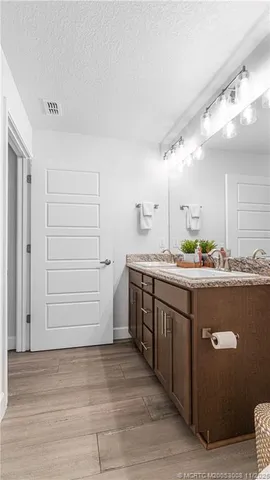 an aerial view of a house with a swimming pool