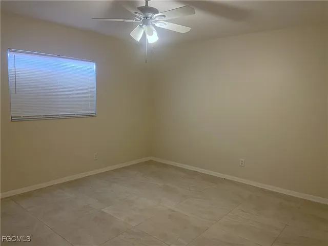 a view of an empty room with a fan