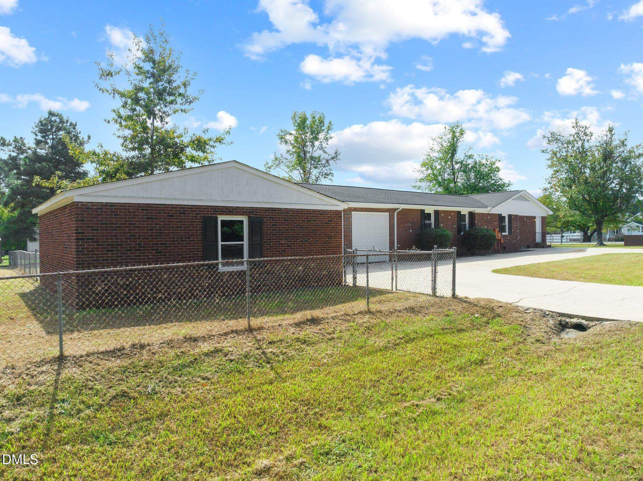 6501 Rock Service Station Road Raleigh, NC 27603 - Photo 10 of 49 a house view with a garden space