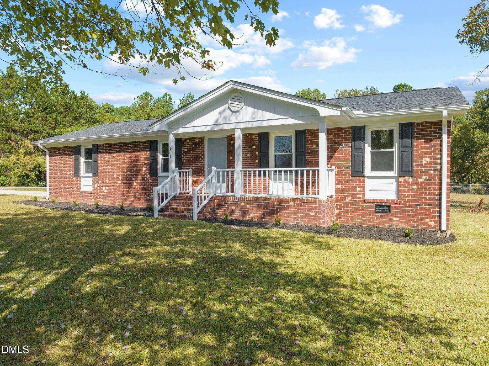 6501 Rock Service Station Road Raleigh, NC 27603 - Photo 5 of 49 a front view of house with yard and green space