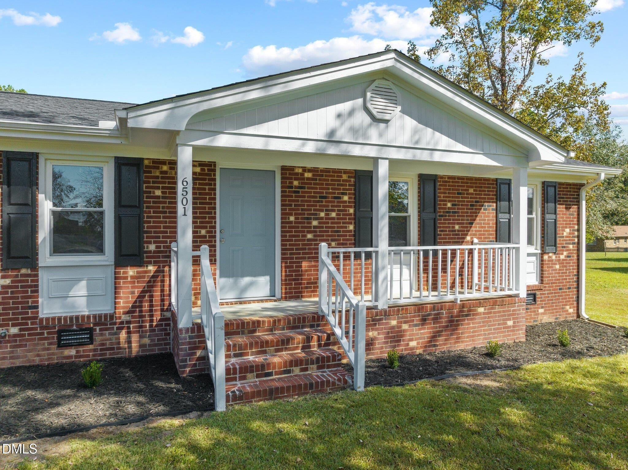 6501 Rock Service Station Road Raleigh, NC 27603 - Photo 6 of 49 front view of a house with a porch