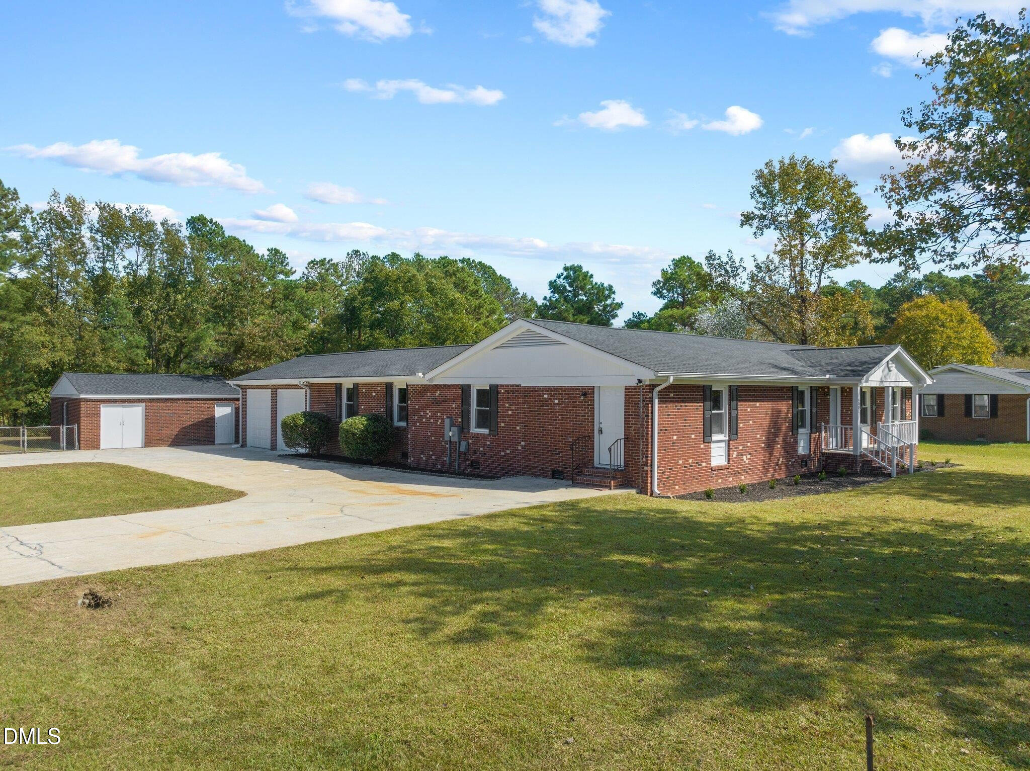 6501 Rock Service Station Road Raleigh, NC 27603 - Photo 9 of 49 a front view of a house with a garden