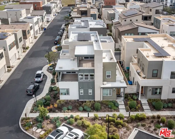 a bathroom with a double vanity sink a mirror and shower