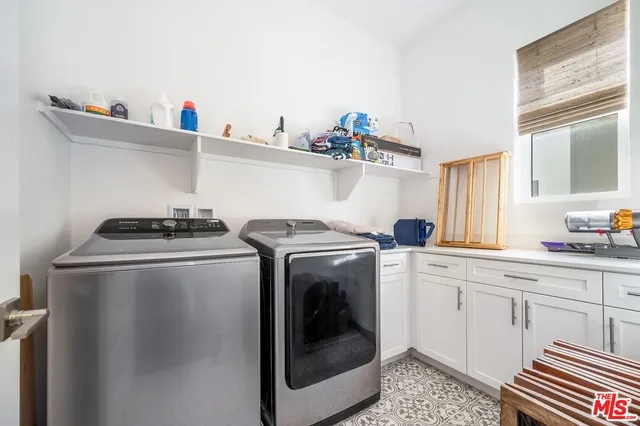 a living room with furniture flat screen tv and a fireplace