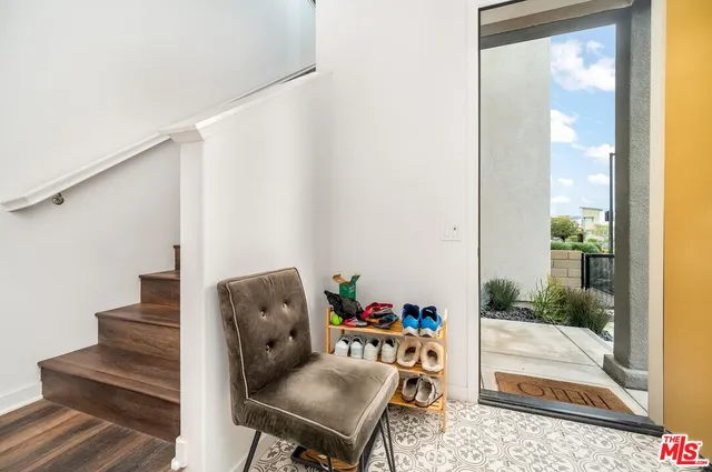 an empty room with large windows