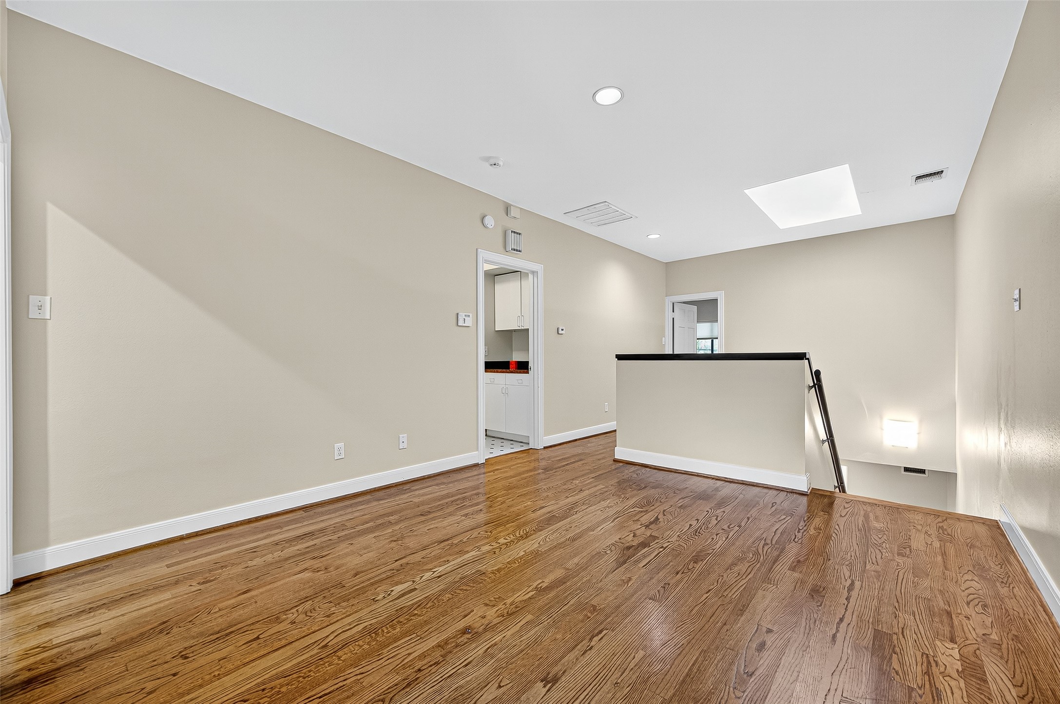 3027 Bissonnet Street Houston, TX 77005 - Photo 26 of 47 Hardwood staircase landing leading up to your private bedroom suites