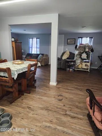 a room with furniture and wooden floor