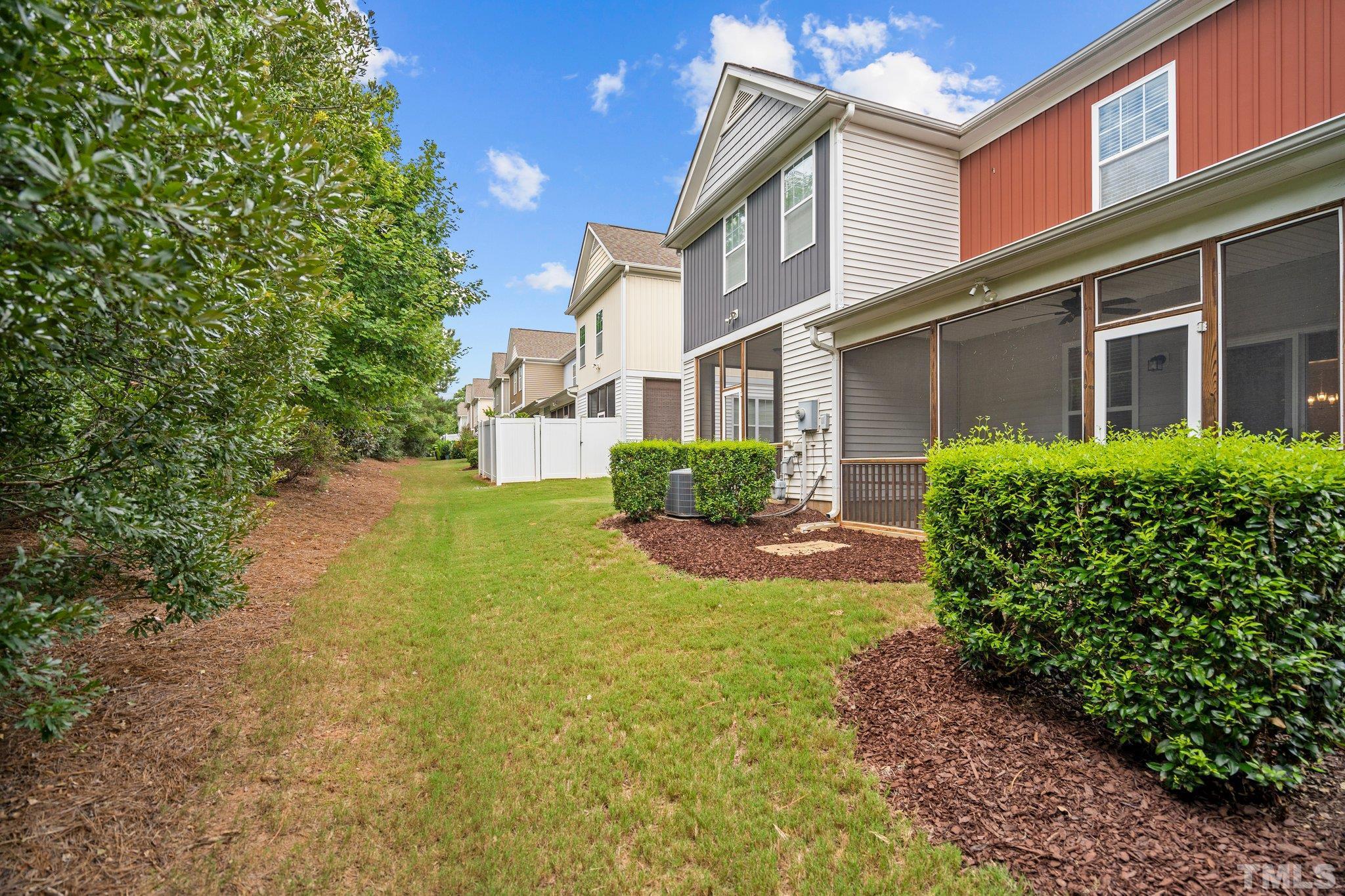 2421 Memory Ridge Drive Raleigh, NC 27606 - Photo 21 of 31 a front view of a house with garden and porch
