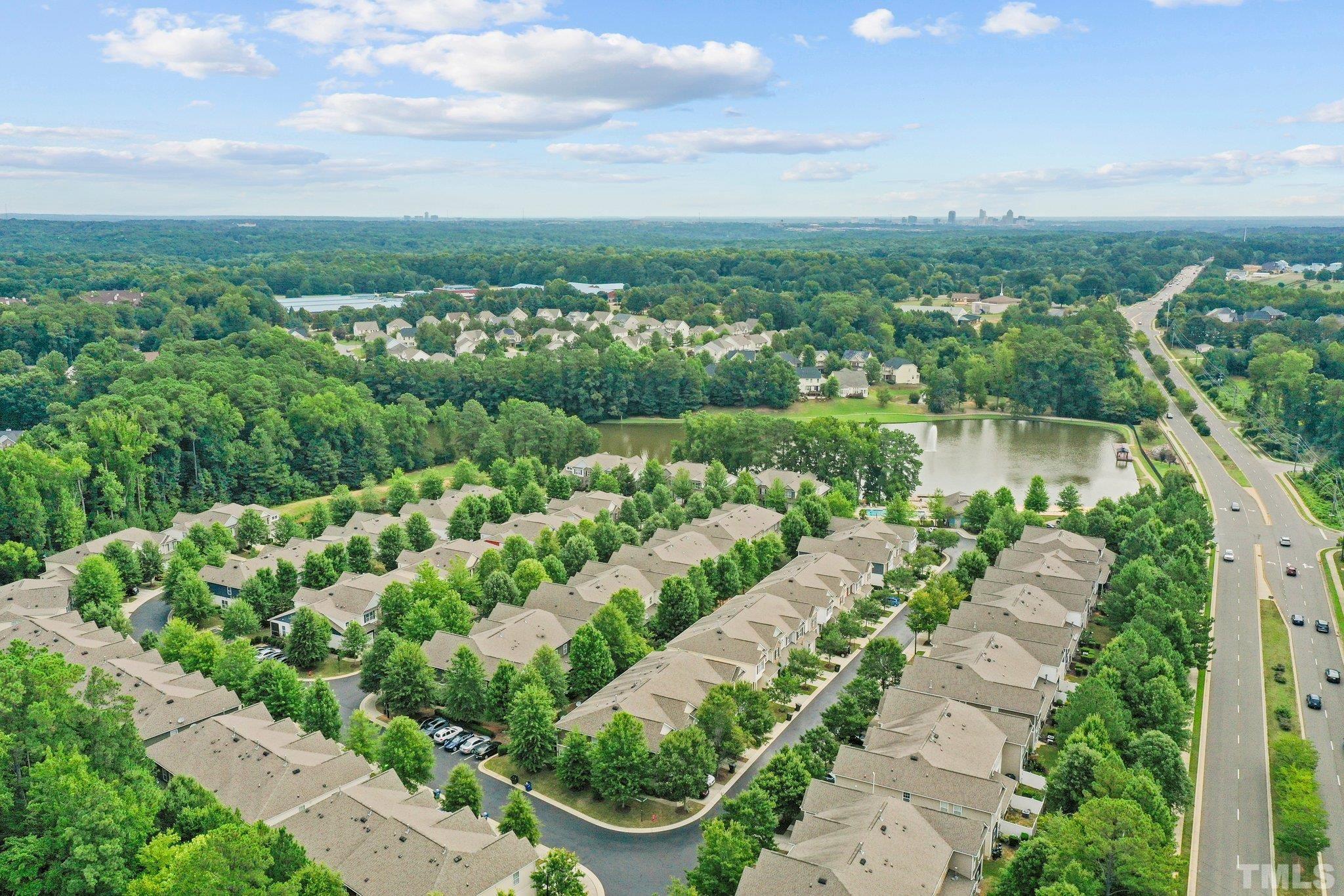 2421 Memory Ridge Drive Raleigh, NC 27606 - Photo 22 of 31 a view of a lake with a city