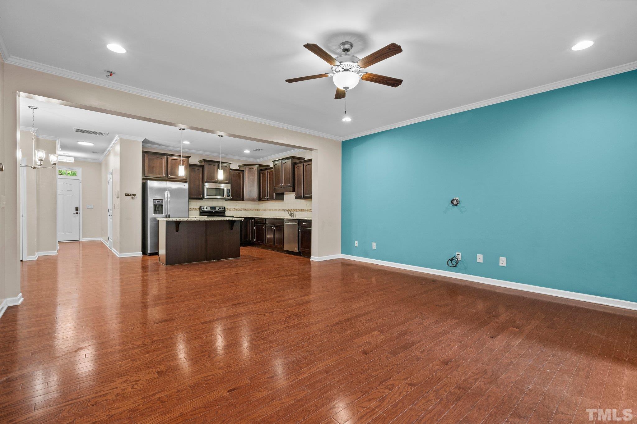 2421 Memory Ridge Drive Raleigh, NC 27606 - Photo 9 of 31 a view of an empty room with kitchen and a window