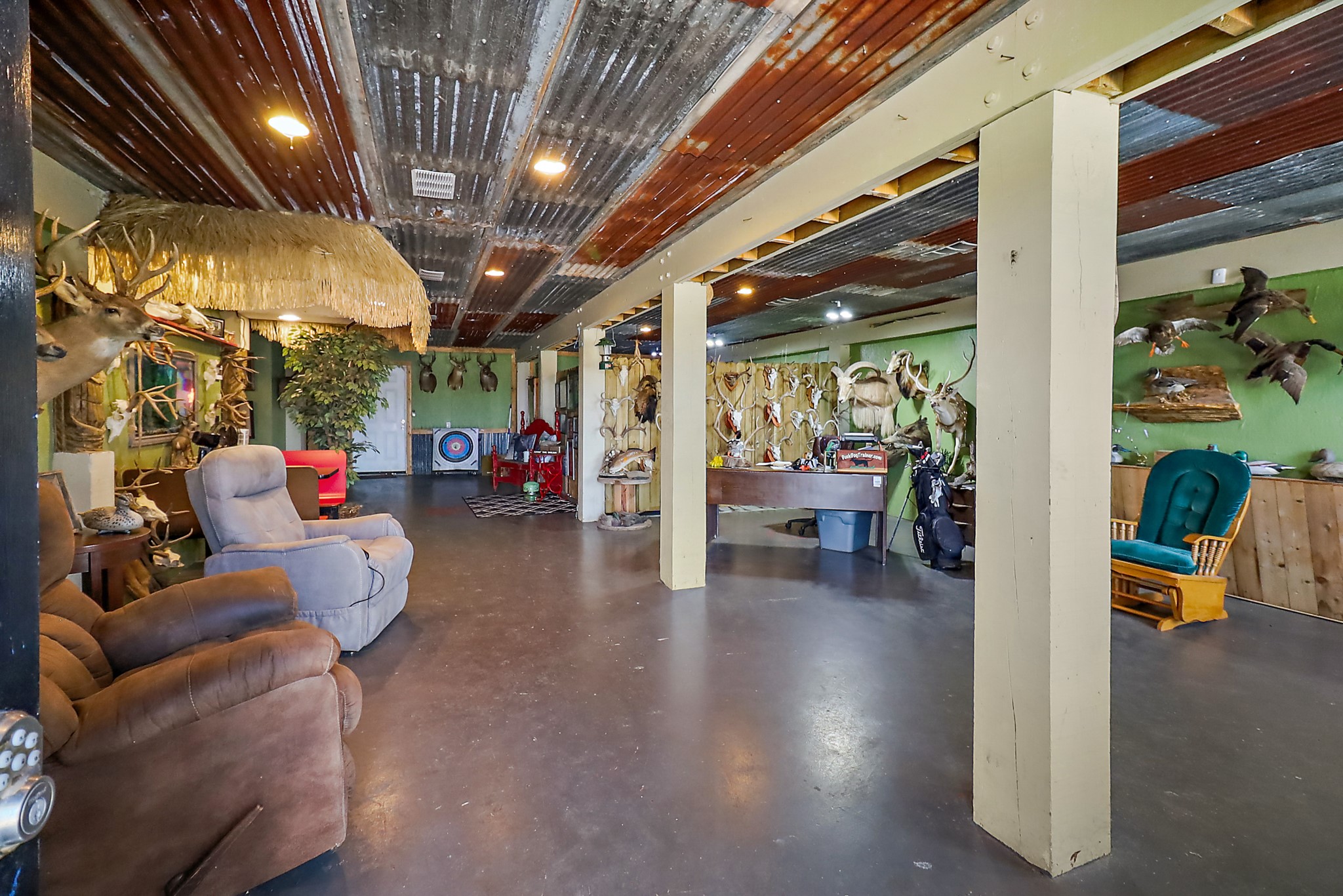 13659 Todd Road Winnie, TX 77665 - Photo 24 of 42 a living room with furniture and a chandelier